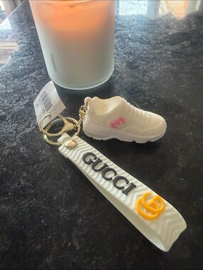 White Keychain with Pink Logo and Yellow GG Accent